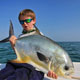 Oliver Anderton with one of many Permit he has caught at the age of 9